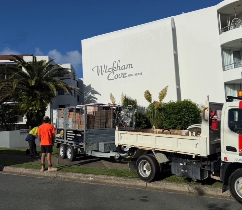 Martin's tip truck and caged trailer on a rubbish removal job